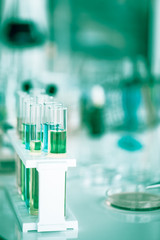 Chemical tube set development and pharmacy in laboratory with green bokeh through windows