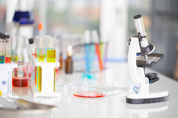 Chemical tube set development and pharmacy in laboratory with green bokeh through windows