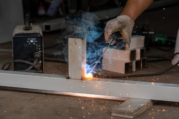 worker cutting metal