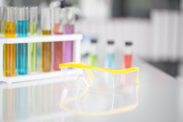 Chemical tube set development and pharmacy in laboratory with green bokeh through windows