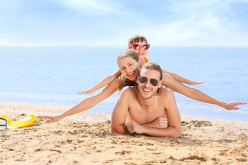 Fototapeta premium Portrait of happy family at sea resort