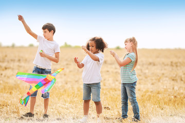 Little children flying kite outdoors