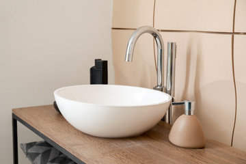 Ceramic sink in modern bathroom