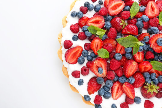 Tasty berry pie on white background