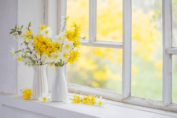 yellow spring flowers on windowsill