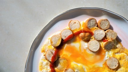 fried eggs with sausages