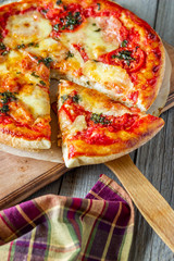 Italian pizza with tomatoes and mozzarella cheese. Italian cuisine. Margherita.
