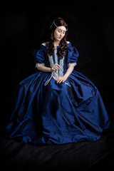 Renaissance woman in blue silk dress