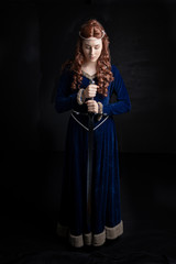 Medieval woman in blue velvet dress