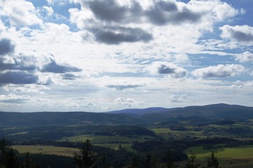 Fototapeta na wymiar clouds over mountains in Nationalpark in Poland Góry Stołowe