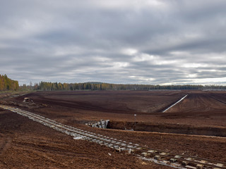 autumn landscape with railroad tracks in peat bog Zilaiskalns, Latvija