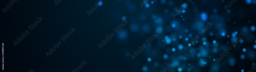 Poster computer generated plenty of blue spots big and small with bokeh on a black background. widescreen 3