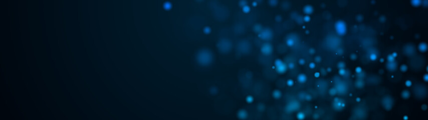 Computer generated plenty of blue spots big and small with bokeh on a black background. Widescreen 3d rendering © turbomotion046