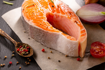 Raw fish steak on slate, healthy food