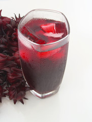 Hibiscus sabdariffa or roselle flowers iced tea on table