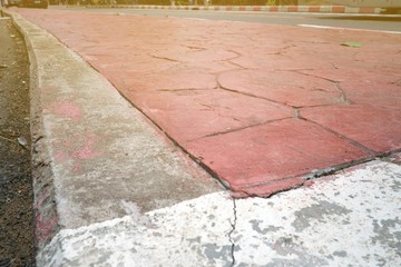 Close up of red paint footpath, Walkway in thailand