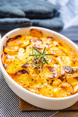 Roasted potatoes in baking dish traditional easten european food titled as france potato