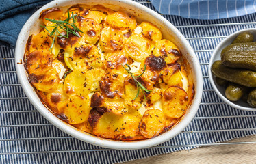 Roasted potatoes in baking dish traditional easten european food titled as france potato