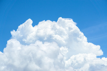 Naklejka na ściany i meble Beautiful view of white fluffy clouds on a clear blue sky background. Nature weather on the vast cloud blue sky. Sky daylight in summer. Natural background with copy space. Element of design.