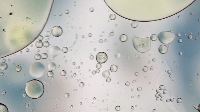 Colorful artistic image of oil drop on water for modern and creation design background.