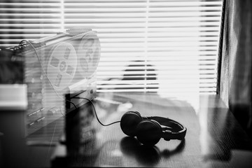Wiretapping on the reel tape recorder. Headphones near the technique. Special agent work. Retro old...