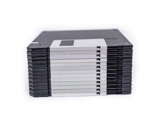 on top of many floppy disk with blank label on white background