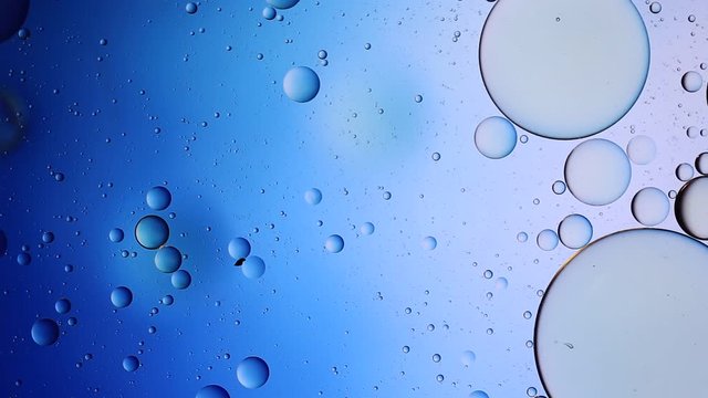 Colorful artistic image of oil drop on water for modern and creation design background.