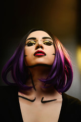 Pop art make up. Woman portrait with purple hair.