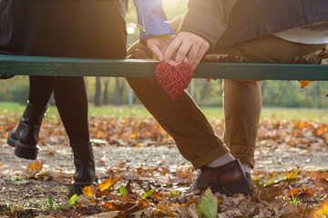 Couple in the park enjoying nice autumn time.
