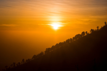 The magnificent views at sunrise from a mountain road trecking to the Ijen volcano or Kawah Ijen