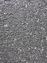 Noisy surface asphalt texture. Close-up photo Black-gray empty surface of old asphalt or tarmac road