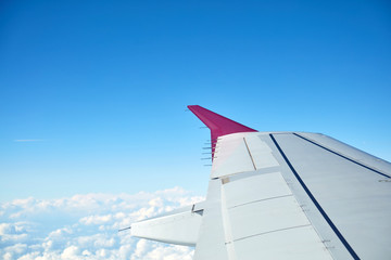 Airplane wing as seen from the passenger's seat.