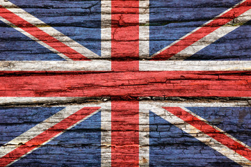 Fototapeta premium Flag of Britain on an old wooden surface.
