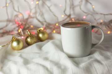 Christmas coffee cup with new year decorations on background.
