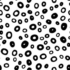 Seamless abstract pattern with round shape in black. Hand drawn circle objects in chaotic composition. Vector illustration for textile print, fabric, wrapping paper. White neutral background.