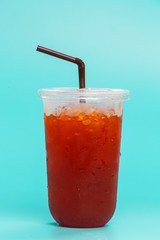 Sales concept, iced lemon tea in clear plastic glasses placed on a blue background.