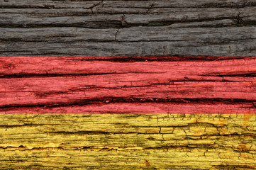 Flag of Germany on an old wooden surface.