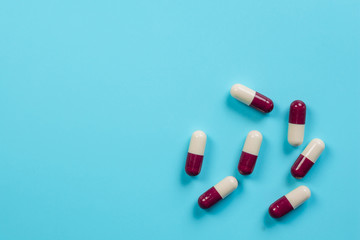 Concept of medicines, medical supplies placed on a blue background.