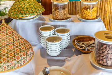 Breakfast with coffee surrounded by various food