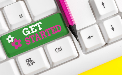 Conceptual hand writing showing Get Started. Concept meaning asking someone to begin task endeavour or process right now White pc keyboard with note paper above the white background