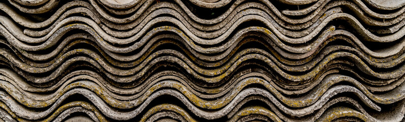 Corrugated sheets of asbestos-cement board. Wavy texture background. Wide picture