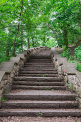 Walk on a warm sunny day in the park Volkspark Friedrichshain in Berlin, stone stairs