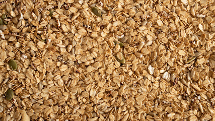 Organic Granola Cereal with oats,almond and pumpkin seeds as background, high nutrition and fibre,ingredients for healthy food or fitness breakfastbenefits for loss wieght