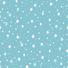 Cozy festive falling snow seamless vector pattern. Scattered transparent dots and spots on pastel blue background. Perfect for packaging, Christmas and New Years projects, cards, greetings and