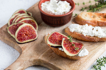 ciabatta or bruschetta with cottage cheese, figs and honey. sandwich with figs and goat cheese