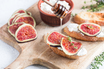 ciabatta or bruschetta with cottage cheese, figs and honey. sandwich with figs and goat cheese