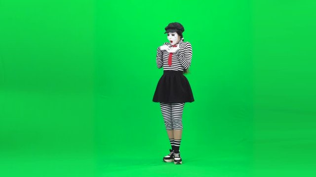 Mime girl sortilege on a flower. Chroma key. Full length.