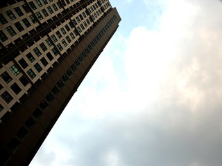 The tilted image of tall buildings and the sky after the rain clouds passed.