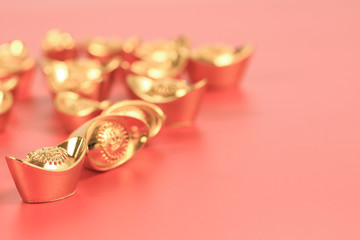 Golden chinese traditional money on red color background. Representing rich, wellness, properity, lucky, happiness for Chinese New Year celebration