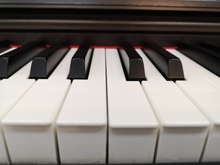 Electric piano keyboard background with close-up focus